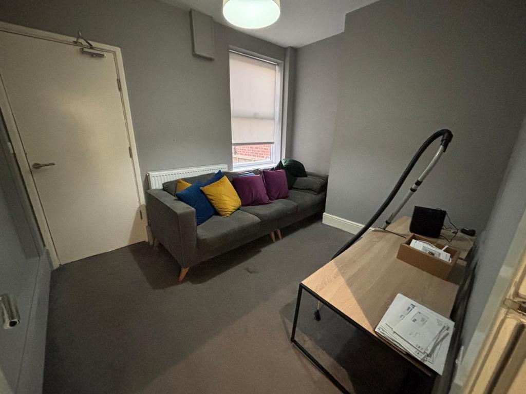 This cozy living room features a comfortable so...