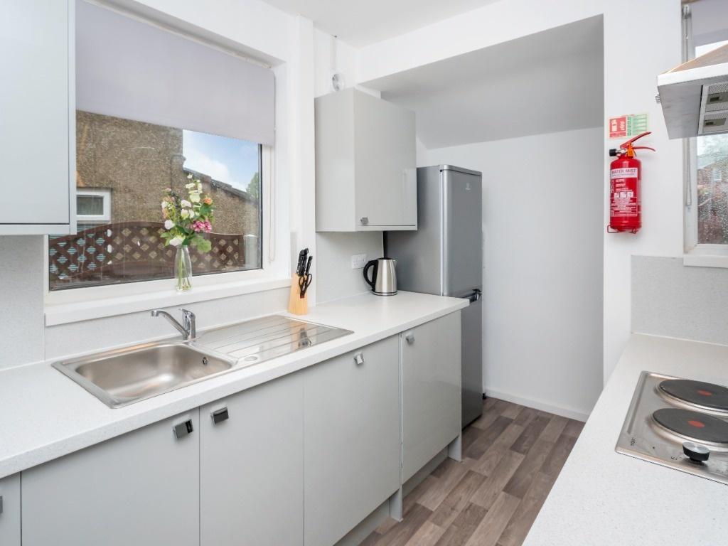 This modern kitchen features contemporary cabin...