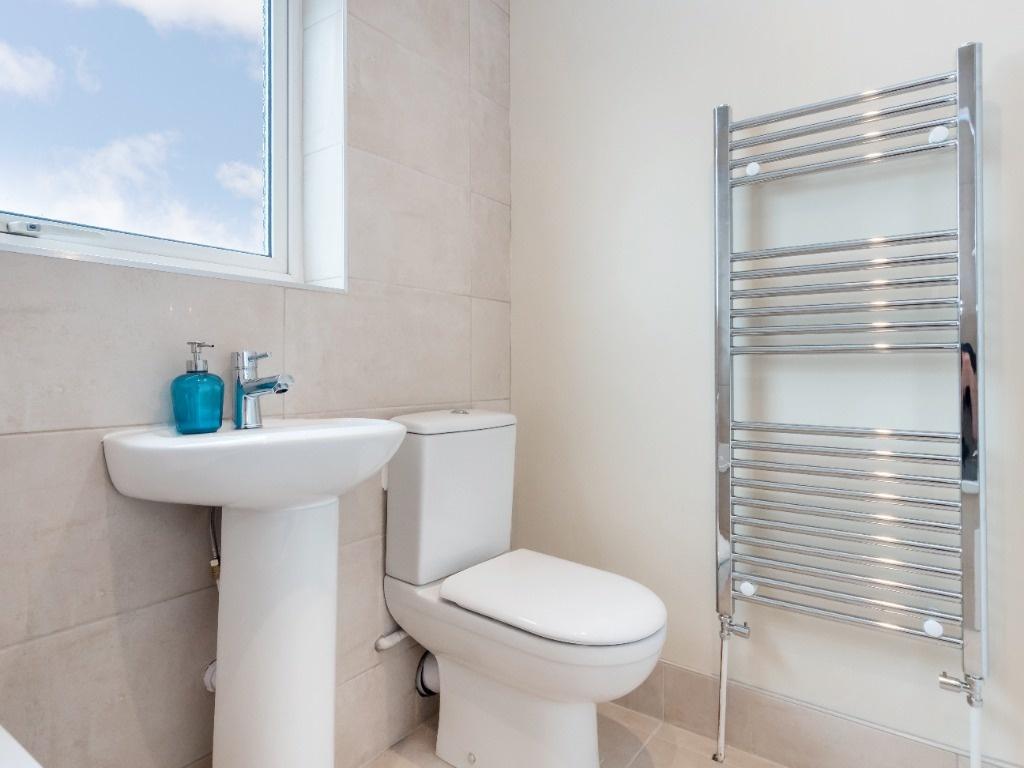 This modern bathroom features a sleek design wi...