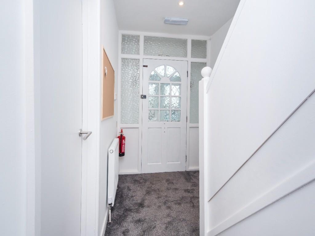 Welcoming hallway featuring stylish decor and a...