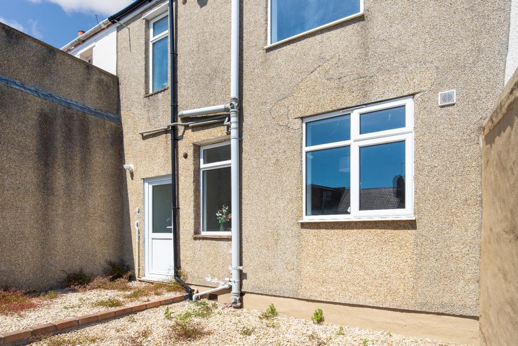 A charming exterior view of the property featur...