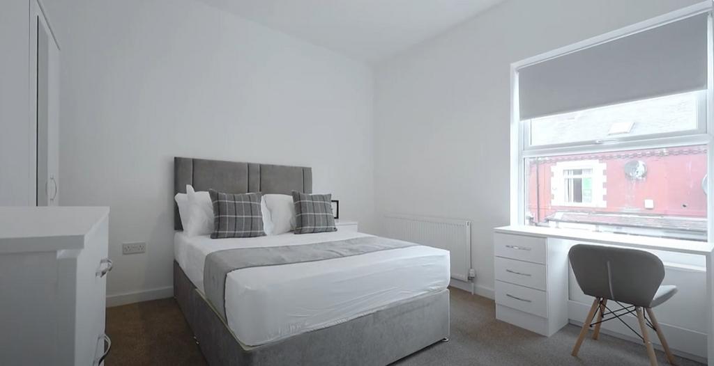 Bright and inviting double bedroom featuring a ...
