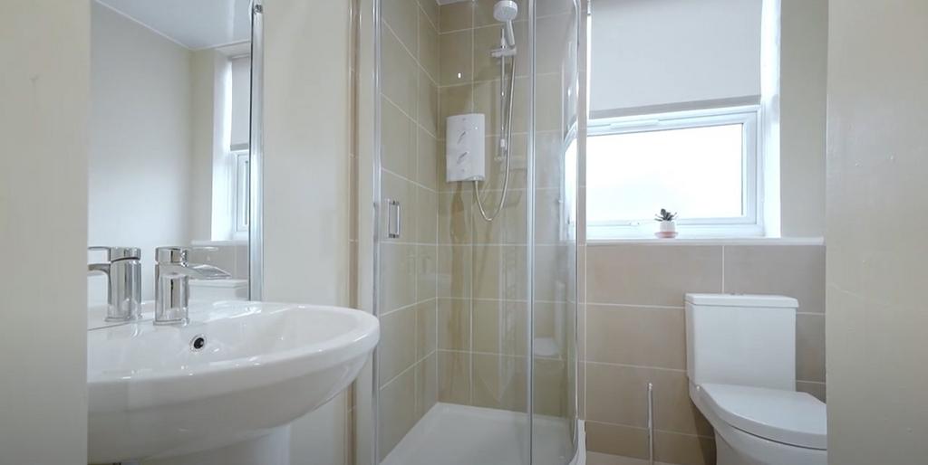 A well-maintained bathroom featuring a modern s...