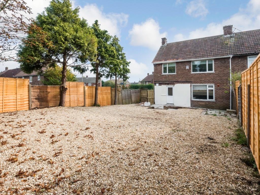 A spacious and well-maintained garden area feat...