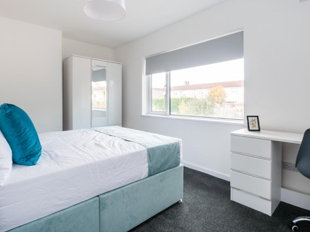 Bright and modern double bedroom featuring a co...