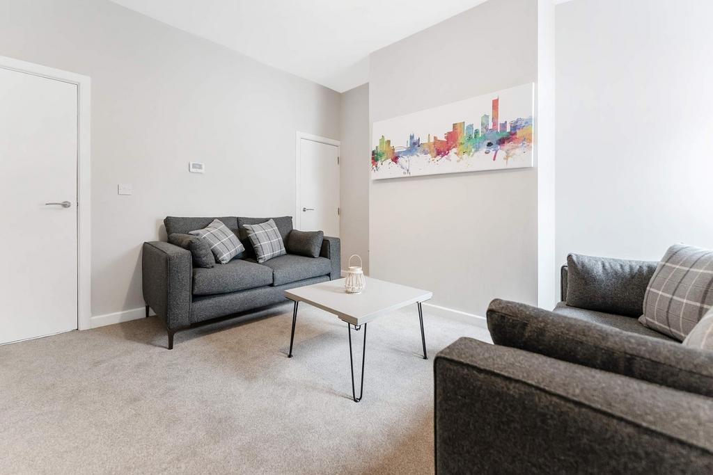 A cozy living room featuring modern furnishings...