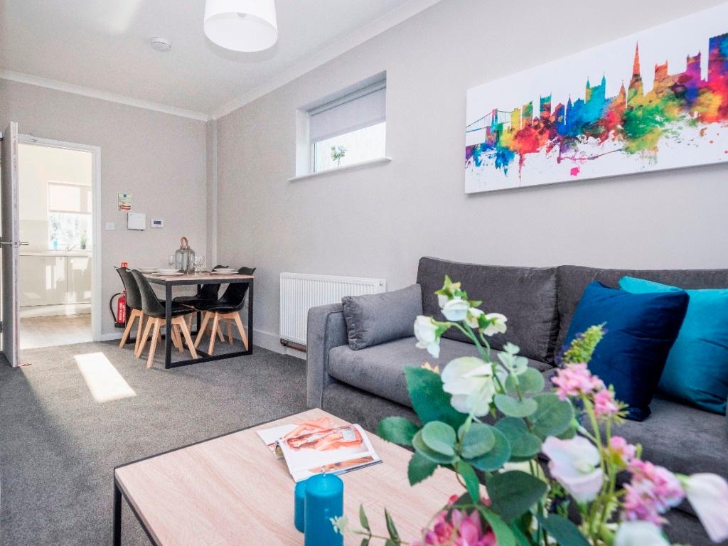 A vibrant living room featuring a cozy sofa, a ...