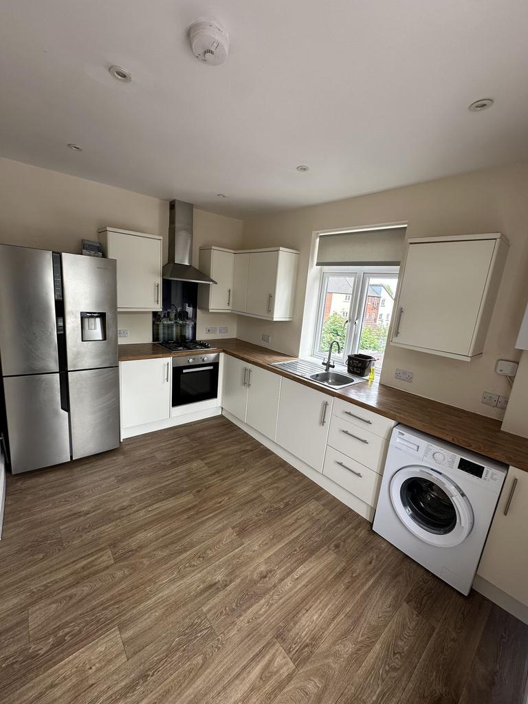 A modern kitchen featuring ample counter space,...