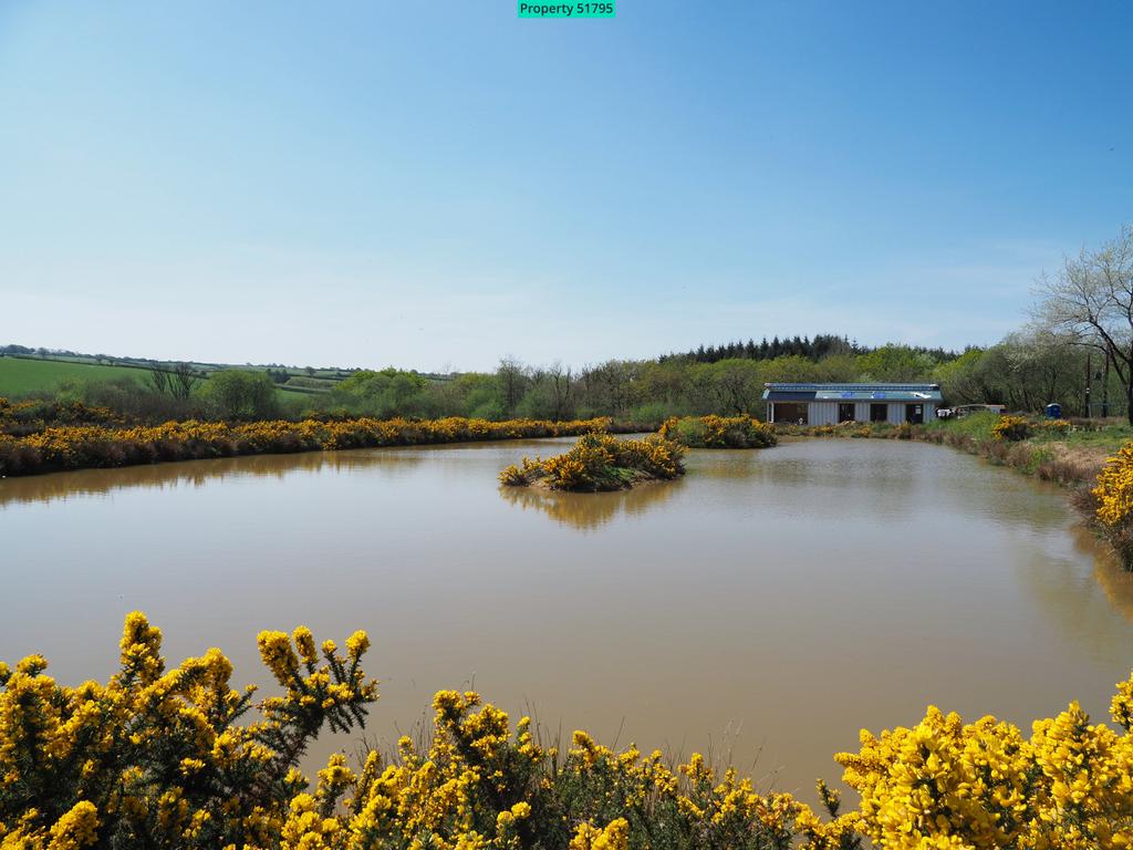 Across the lake, a holiday lodge under constructio