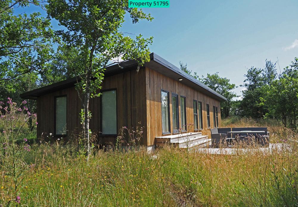 An existing holiday lodge nestling in the natural