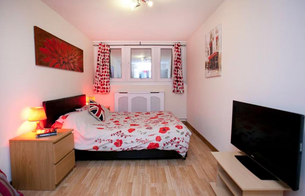 A bright and inviting double bedroom featuring ...