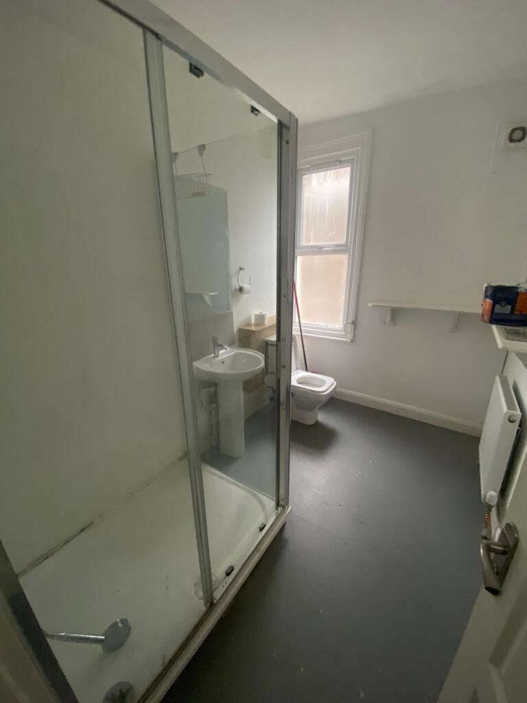 Bright and modern bathroom featuring a spacious...