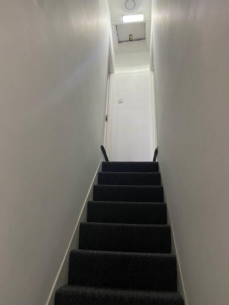 A well-maintained staircase leading to the uppe...