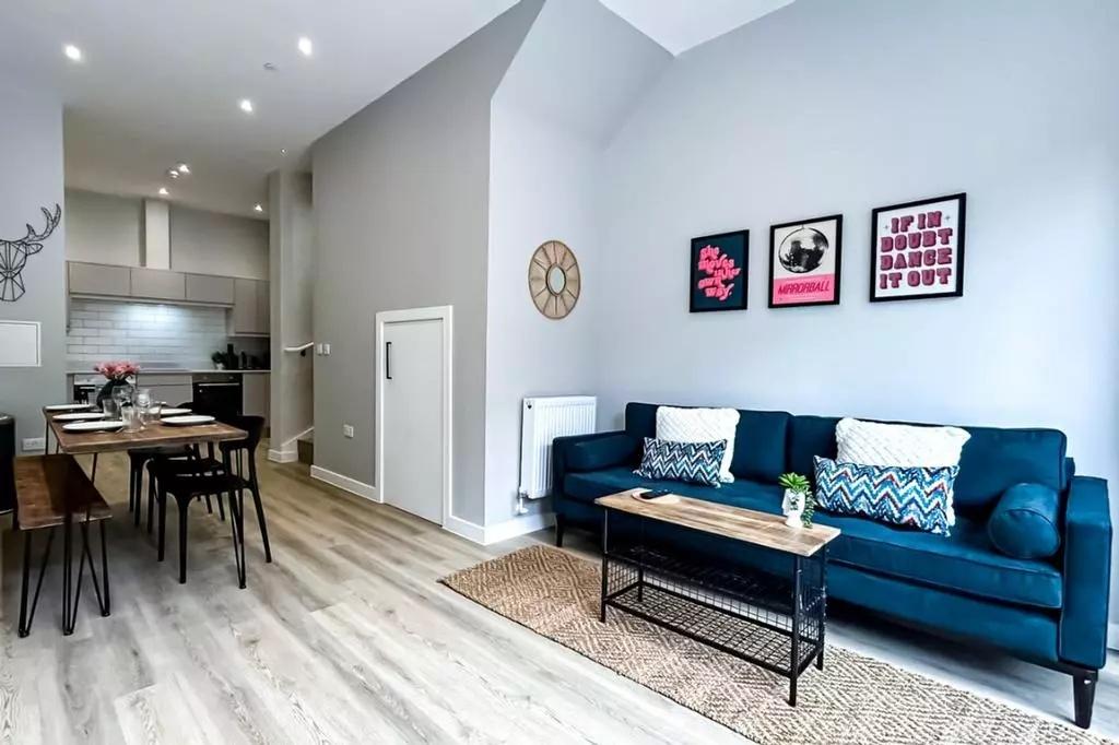 A modern and stylish living room featuring a de...