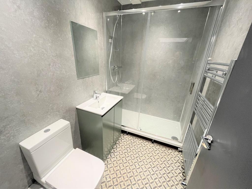 A modern and stylish bathroom featuring a sleek...