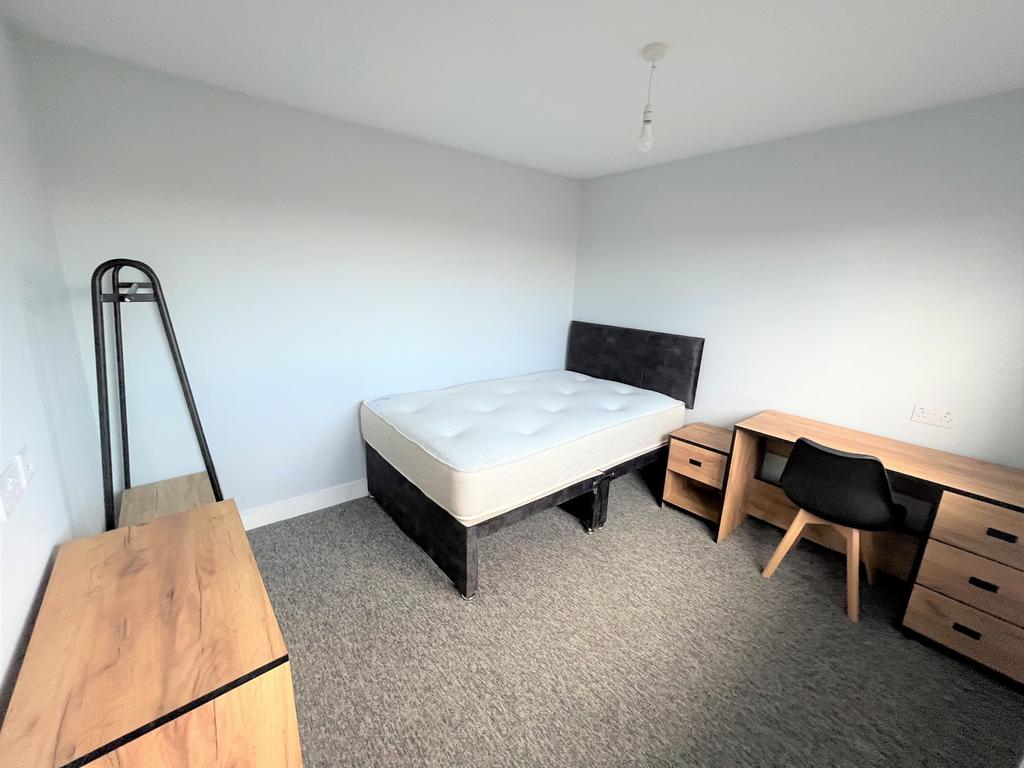 A spacious and inviting double bedroom, perfect...