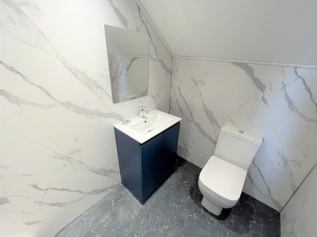 A modern and stylish bathroom featuring elegant...