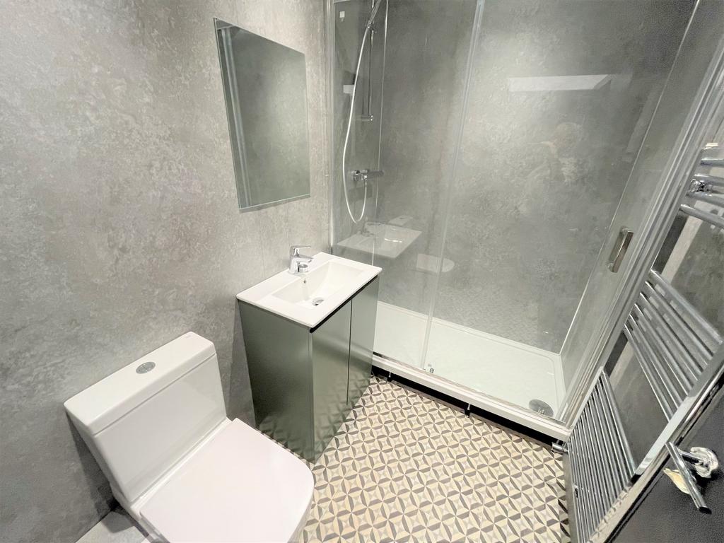 A modern and stylish bathroom featuring a sleek...