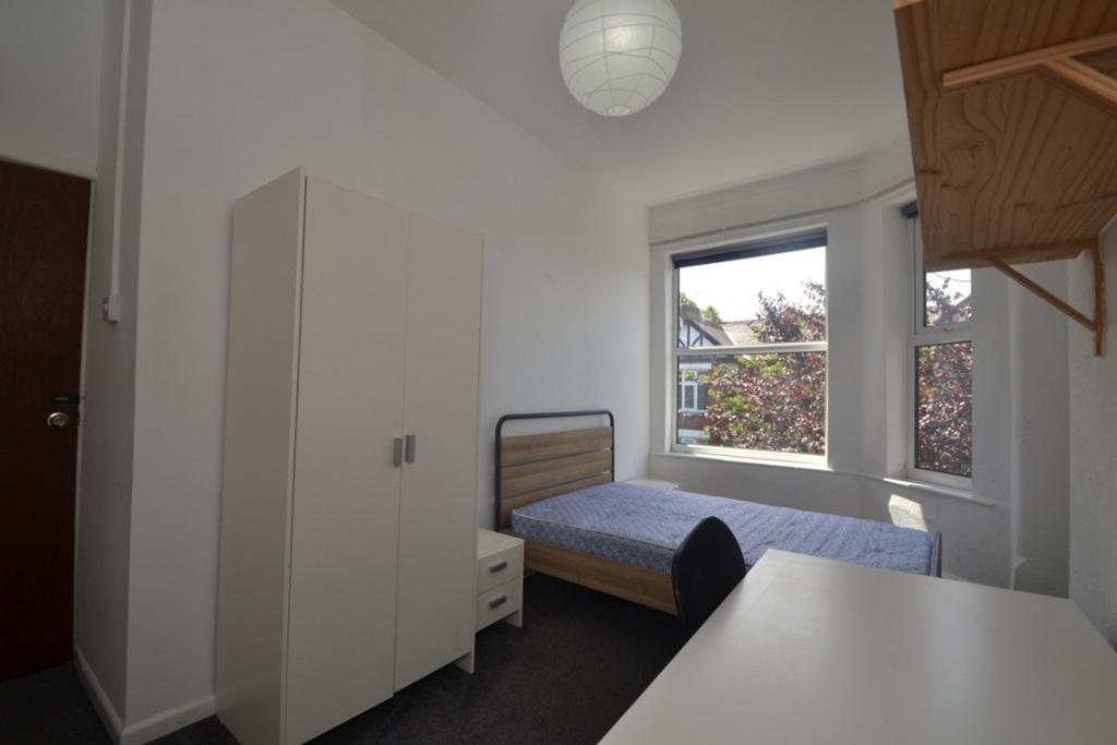 Bright and inviting double bedroom featuring a ...