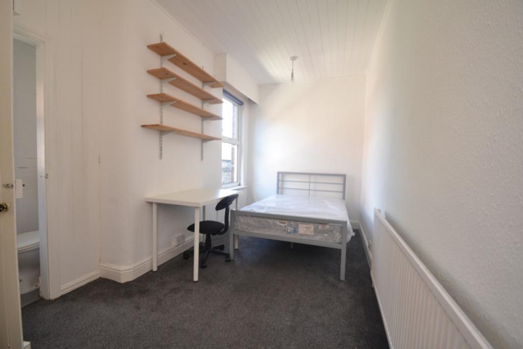 Bright and spacious double bedroom featuring am...