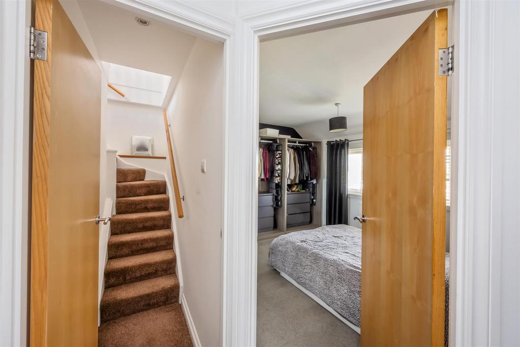 Stairs rising to Second Floor