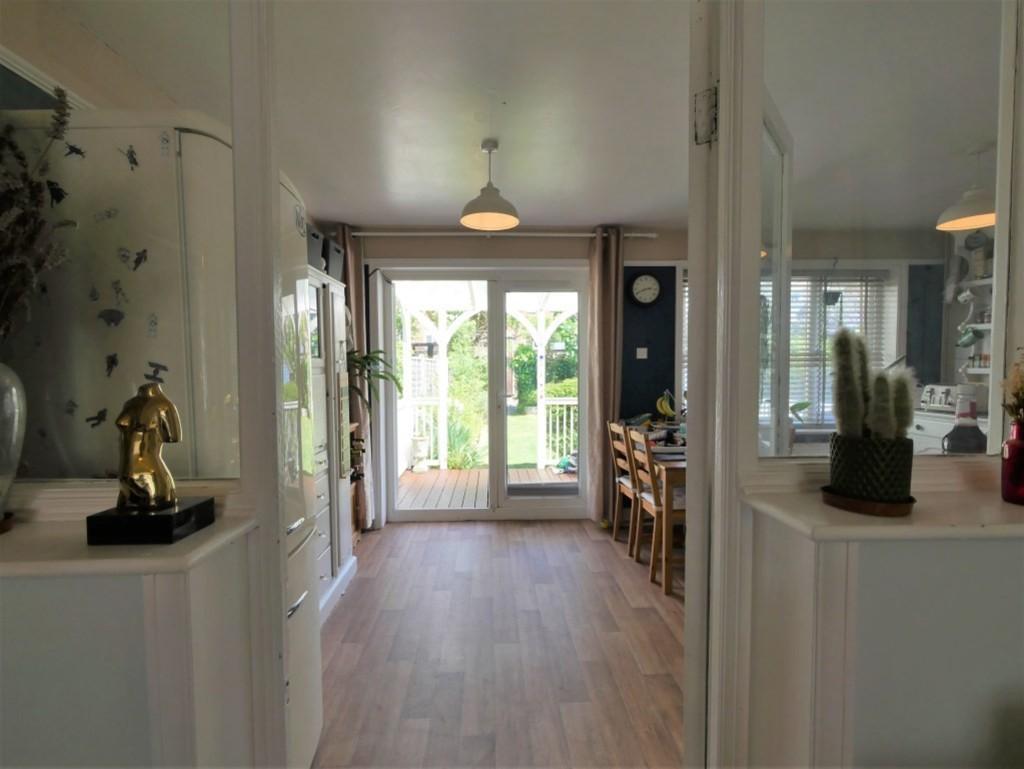 Sitting and family room through to kitchen diner