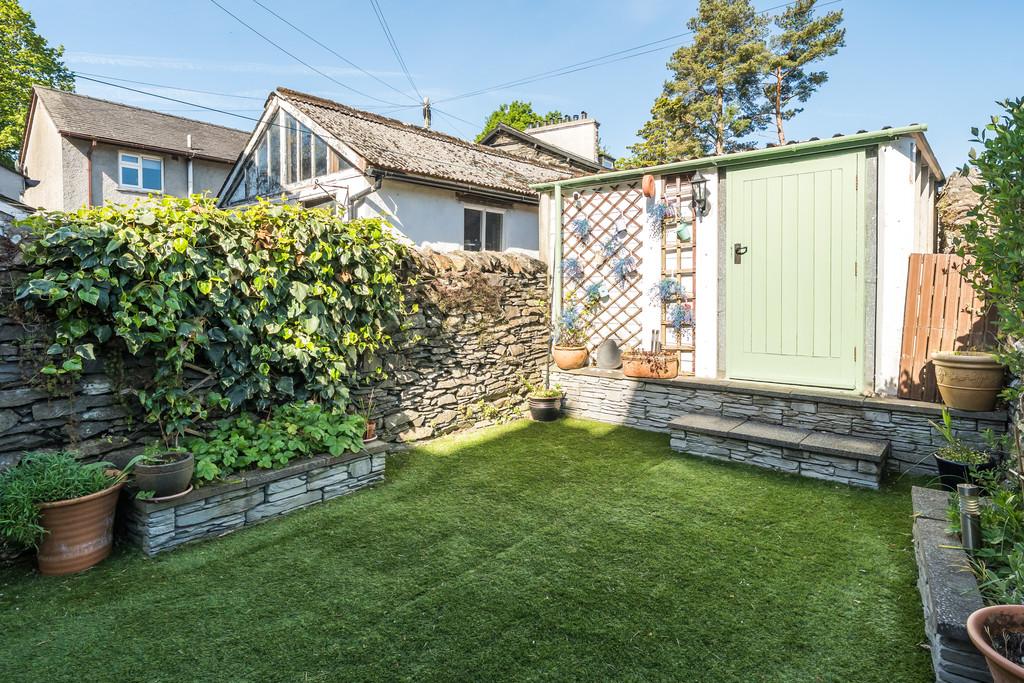 Rear Garden with garage entrance