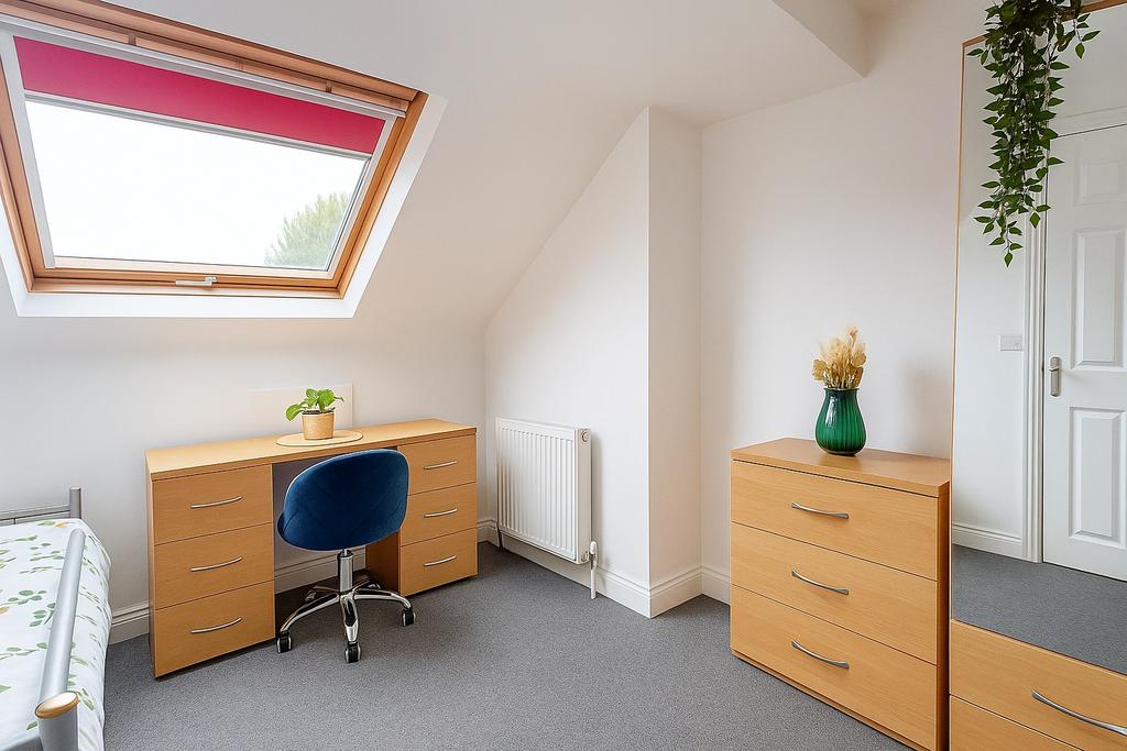 Bright, well-presented bedroom with a large sky...