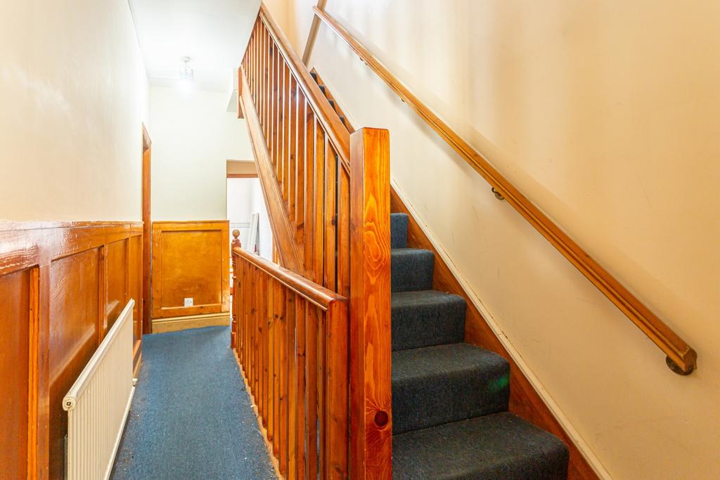 A well-maintained staircase with natural wood a...