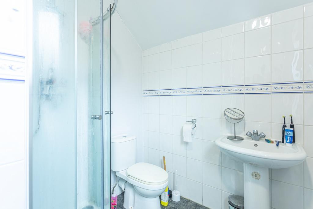 A well-maintained bathroom featuring a modern s...