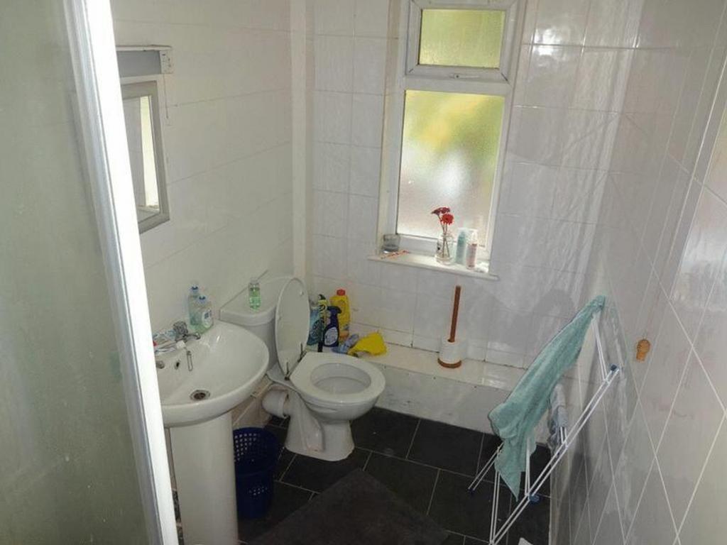 A functional and tidy bathroom with natural lig...