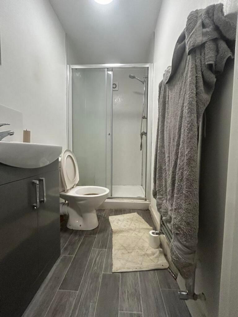 A modern bathroom featuring a shower and stylis...
