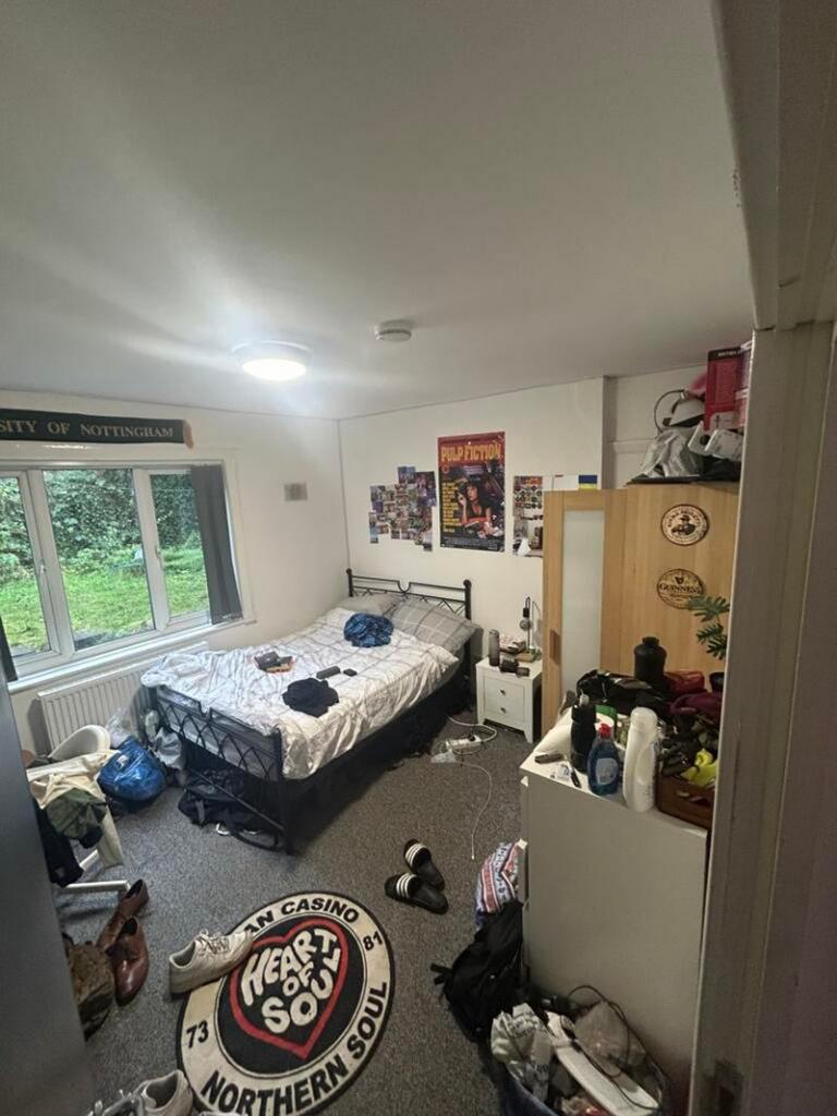 A spacious double bedroom with ample room for p...