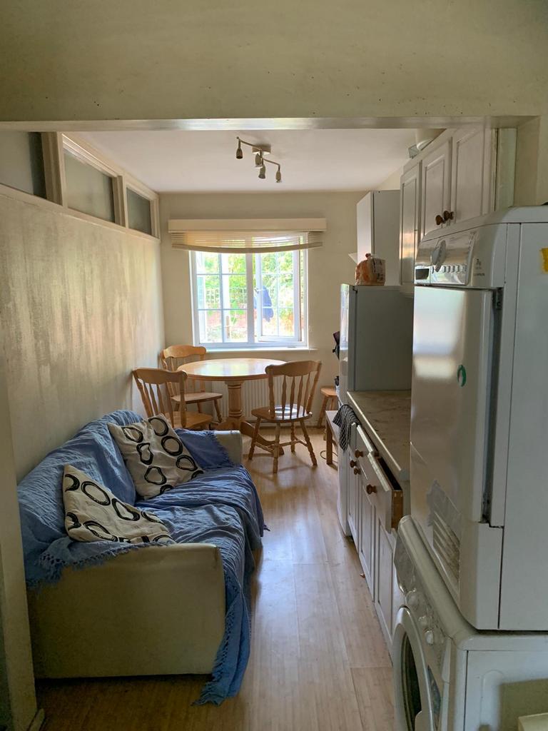 Bright and inviting kitchen space featuring amp...