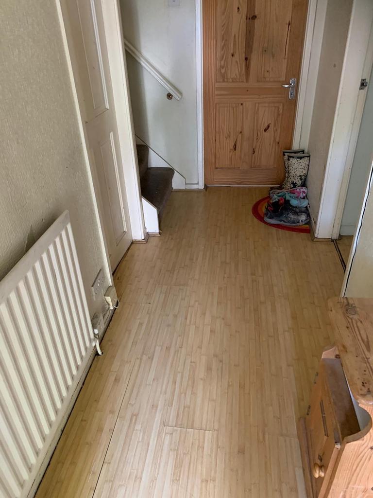 Welcoming hallway with natural light, featuring...