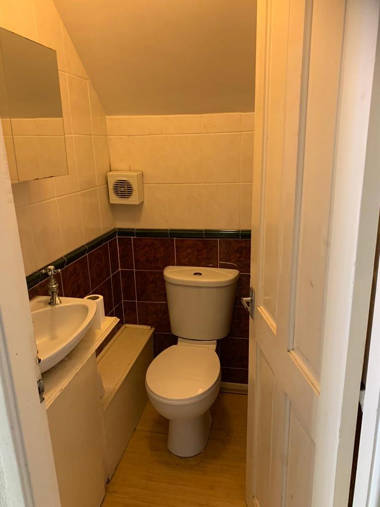 Cozy and functional single toilet space with mo...