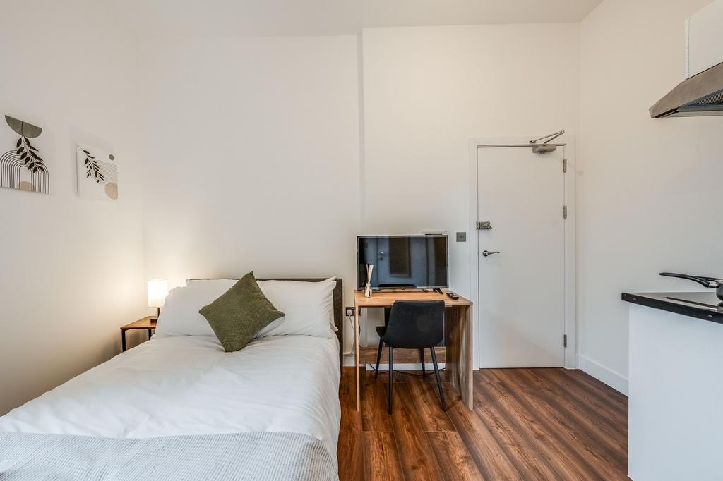 This charming double bedroom offers a cozy retr...