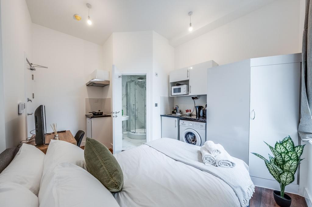 This inviting double bedroom features a cozy la...