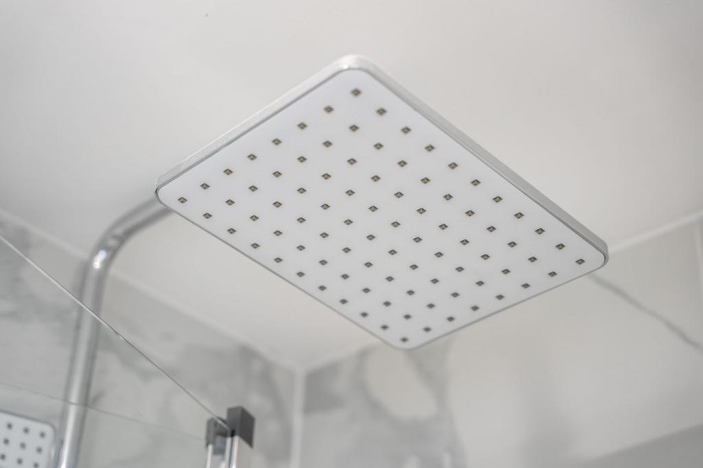 Close-up view of a modern square rain shower he...