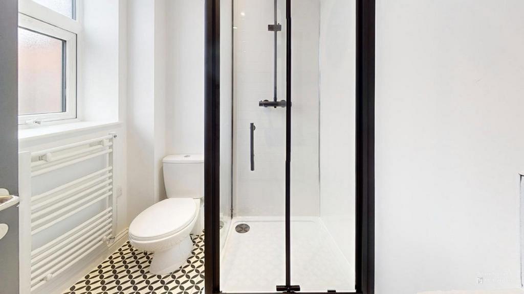 A bright and modern bathroom featuring a stylis...