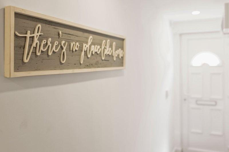 A bright and clean hallway featuring a welcomin...