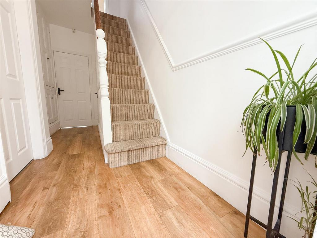 Stairs rising to the first floor