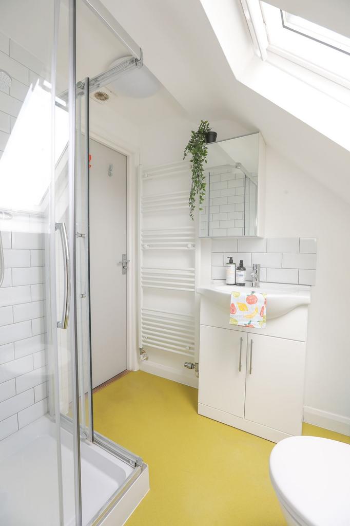 A bright and modern bathroom featuring a spacio...