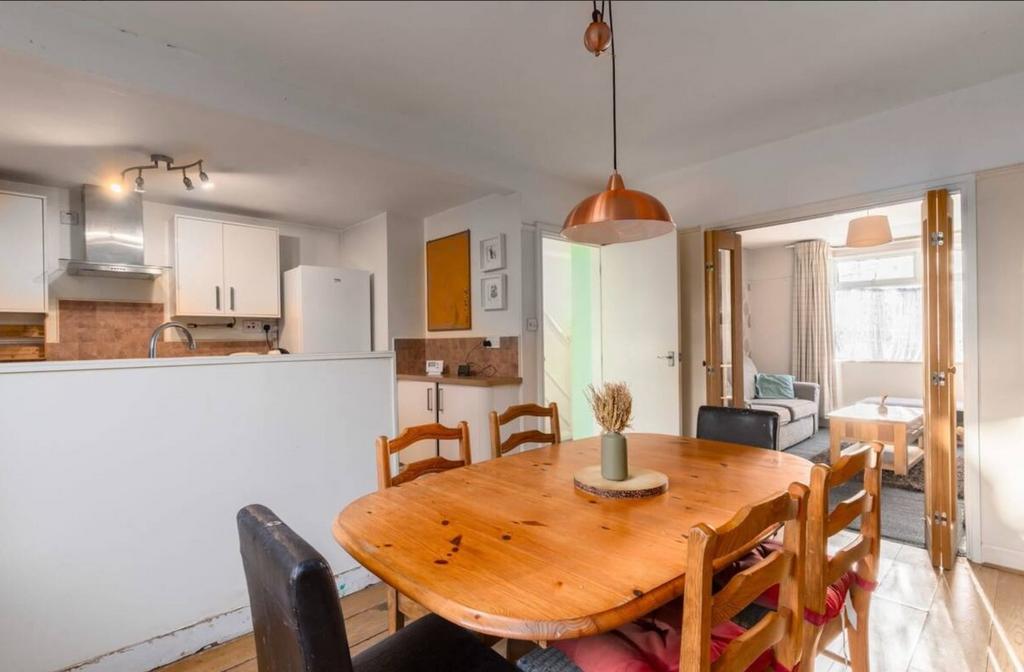 A bright and inviting kitchenette with a warm w...
