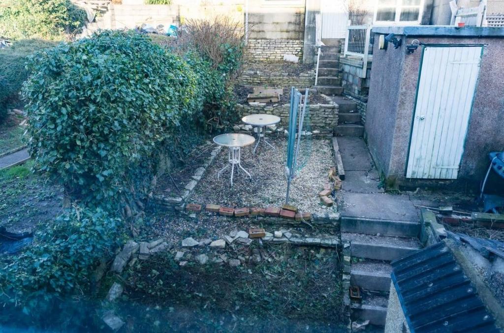 A spacious garden area with two tables, perfect...