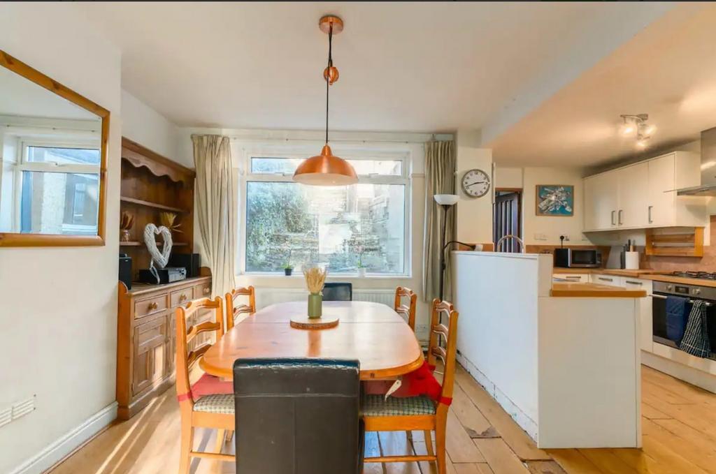 A spacious and bright kitchen area featuring a ...