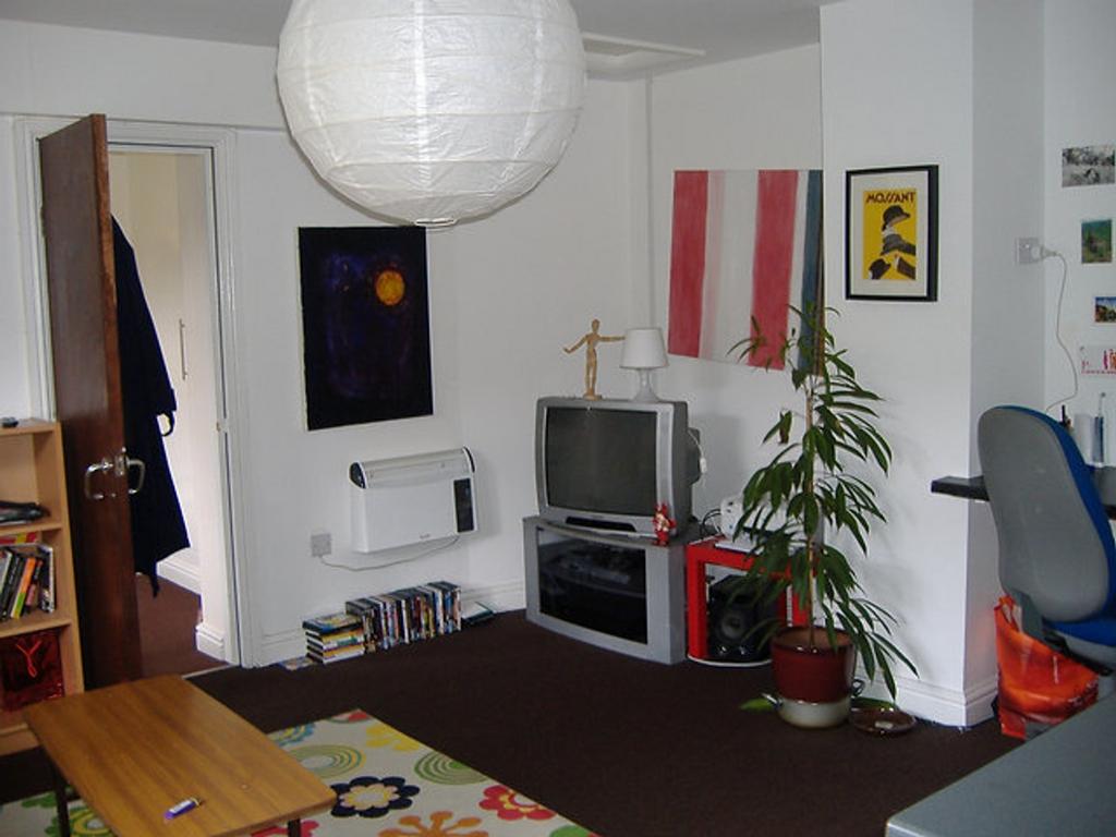 This vibrant living room features a cozy atmosp...