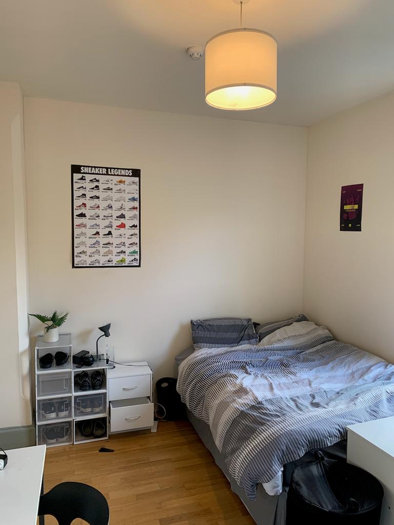 A bright and inviting double bedroom featuring ...