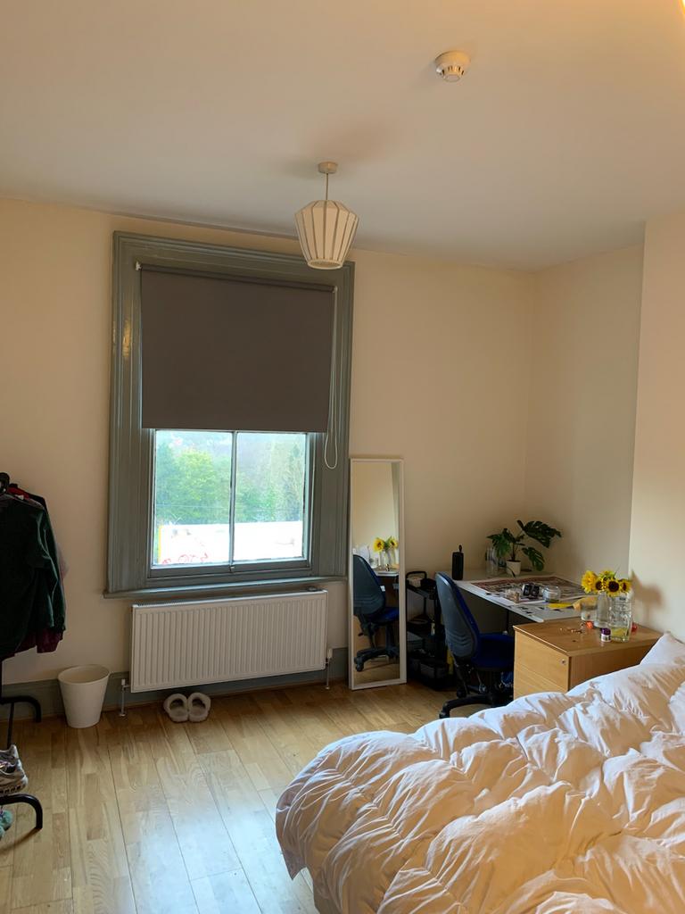 A cozy and inviting double bedroom with natural...