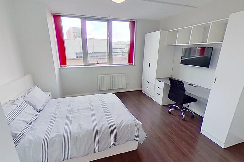 Bright and inviting double bedroom featuring a ...